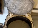 a dirty toilet that is sitting in the middle of a room