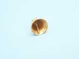 an image of a gold ring on a blue surface