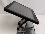 a tablet that is sitting on a stand on a table