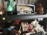 a shelf full of toys and other items on a shelf