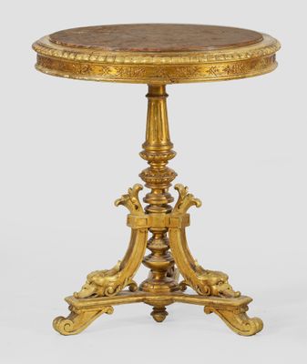 a gold - plated table with a marble top