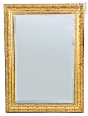 a gold framed mirror on a white background