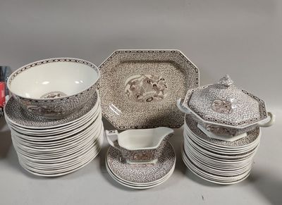 a lot of dishes and cups sitting on a table