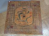 a wooden box with a painting of a snake on it