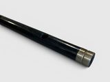 a close up of a pen on a white surface with a white background