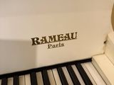 a white piano that is sitting in a room