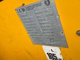 a close up of a sign on the side of a yellow machine