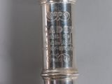 a close up of a silver object on a table