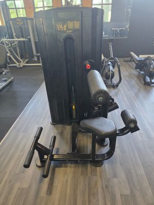 a gym room with a bench, weights, and other equipment