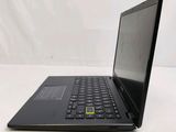 a black laptop with a yellow sticker on it