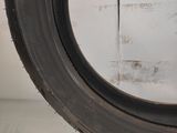a close up of a tire tire on a shelf in a room