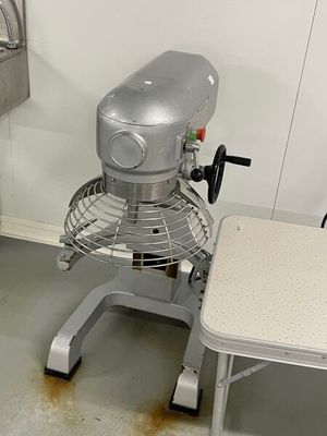 an image of a kitchen with a mixer and a table