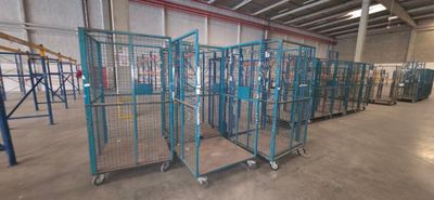 a large room with a lot of cages on the floor