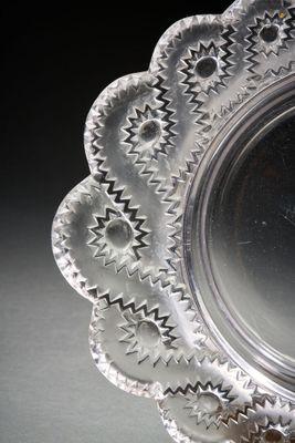 a silver plate with a star design on it