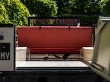 a large red box sitting on the back of a truck