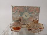 a glass table with a box of perfumes on top of it