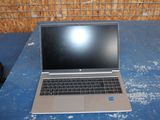 a laptop that is sitting on a blue table