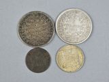 three different types of coins sitting on top of a table