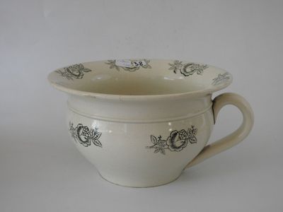 a white bowl with a black design on it