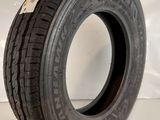 a close up of a tire on a white surface