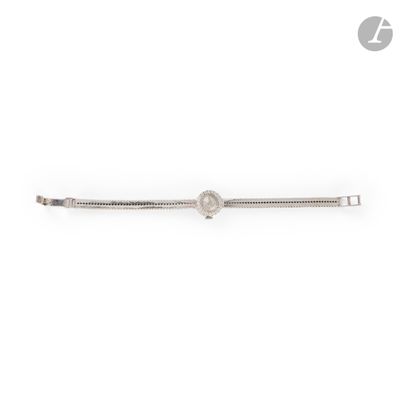 a close up of a diamond bracelet on a white background
