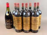 six bottles of red wine are lined up in a row