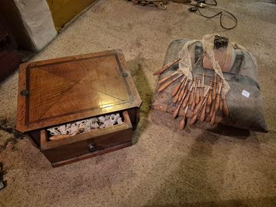 a small wooden box with a bunch of matches inside of it