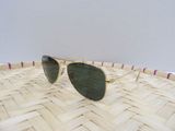 a pair of sunglasses sitting on top of a woven basket