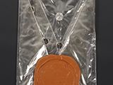 a wax seal in a plastic bag on a table