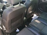 the back seats of a car with luggage in the back of it