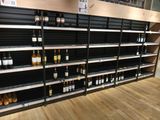 many bottles of wine on the shelves in the store