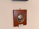 three framed pictures hanging on the wall of a room