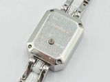 an image of a close up of a wrist watch on a white surface