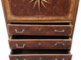 an image of a chest of drawers with a clock on top