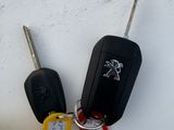 three keys that are sitting next to each other on a table