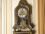 a clock hanging on a wall in a room