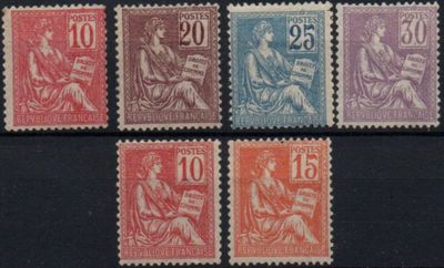 a group of stamps with different colors on them on a black surface