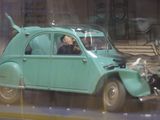 a blue car that is sitting in a display case