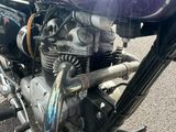 a motorcycle that is parked on the side of the road