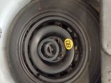 a close up of a tire with a yellow sticker on it