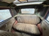 a dirty seat in the back of a car