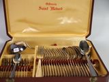 a box with silverware in it on a table