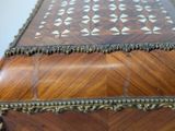 a wooden box that has a decorative design on it