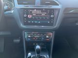 the interior of a car with a steering control and dashboard controls
