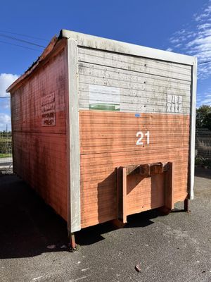 a small wooden building with a number twenty on it