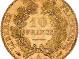 a gold coin with a wreath on the front of it