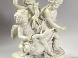 a statue of a boy and a girl sitting on a box