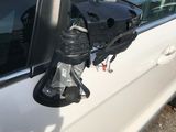 an image of a car door mirror with a bag on it