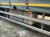 the back end of a truck with a large tank attached to it