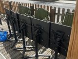a row of chairs that are on the side of the street